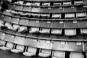 brown wooden chairs on gray concrete floor